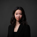 Professional corporate headshot of a Calgary businesswoman wearing a black blazer
