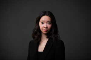 Professional corporate headshot of a Calgary businesswoman wearing a black blazer